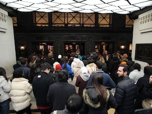 Shoppers enter Selfridges in London's Oxford Street as the department store opens its doors for the Boxing Day sale