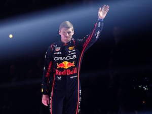 Red Bull driver Max Verstappen waves at the fans in London