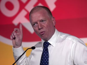 Headshot of Matt Wrack pointing while speaking