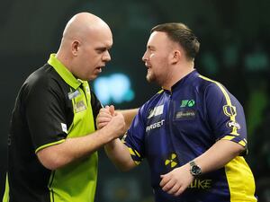 Michael van Gerwen and Luke Littler on stage