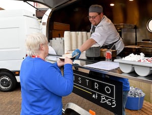 Trainee chefs from Halesowen College serving free hot meals to the public to raise spirits on Blue Monday. 