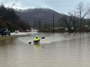 A kayaker in flood water