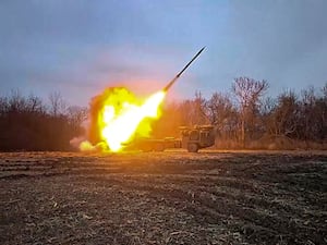 A Russian self-propelled multiple rocket launcher being fired