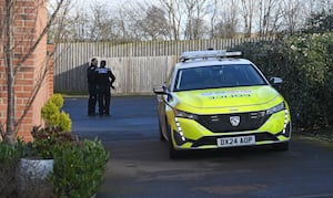 A man has been arrested on suspicion of murder following the death of a woman found in critical condition at an address on Devereux Gardens