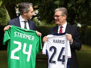 Ireland's PM Simon Harris and Sir Keir Starmer swap football shirts during a visit to Dublin