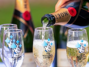 Champagne is poured into Lotto-branded flutes