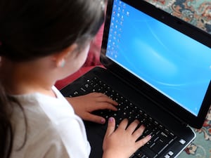 A child using a laptop