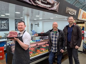 Councillor Wayne Little and Councillor Adam Davies welcome new butcher Nathan Jones to Brierley Hill Market