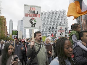 People take part in a Palestine Solidarity Campaign rally in central London (PA)