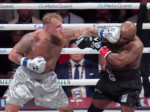 Jake Paul lands a left on Mike Tyson