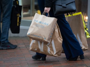 People carry shopping bags in Bournemouth