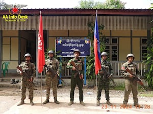 Members of the Arakan Army in front of a captured district police office