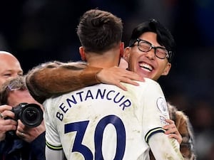 Son Heung-min (right) embraces team-mate Rodrigo Bentancur