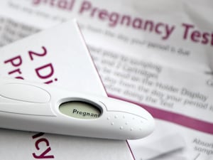 A pregnancy test kit indicating pregnancy