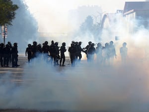 Paramilitary soldiers fire tear gas shells to disperse supporters of Imran Khan’s party during clashes in Islamabad