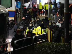 Police officers stand in front of the gate of the presidential residence of impeached South Korean President Yoon Suk Yeol in Seoul