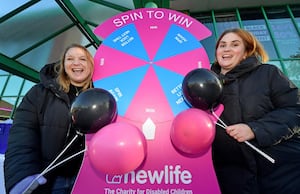 Karen Cox and Abbey Costello from Newlife charity, Cannock, with the Spin to Win game.