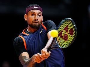 Nick Kyrgios looks at the ball