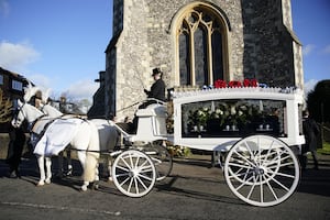 A horse-drawn carriage carrying the coffin of Liam Payne arrives for the funeral service of One Direction singer at St Mary's Church in Amersham, Buckinghamshire. Picture date: Wednesday November 20, 2024. 