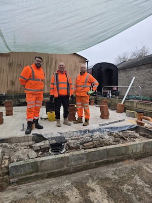 Volunteers from Network Rail building a volunteer's shower block at the SVR as part of the partnership between the two organisations. 