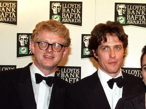 Some of the cast and crew from Four Weddings And A Funeral, including Richard Curtis and Hugh Grant