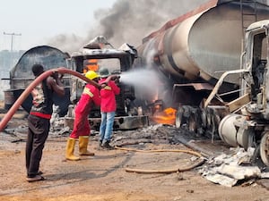 Firefighters extinguishing a tanker blaze