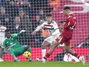 Liverpool’s Trent Alexander-Arnold attempts a shot on goal against Manchester United