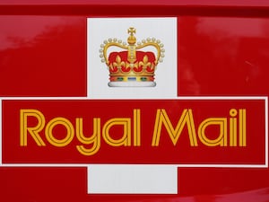 File photo dated 20/01/15 of Royal Mail branding on the side of a post van in Cambridge.