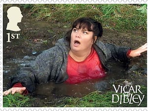 A stamp showing an unsuspecting Geraldine jumping into a very deep puddle