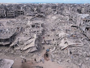 Overhead image of displaced Palestinians amid a devastated landscape