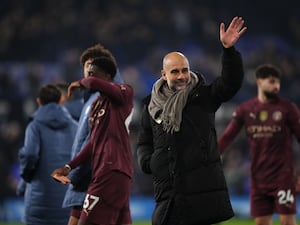 Manchester City manager Pep Guardiola salutes the fans