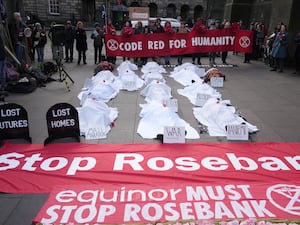 Climate activists from Greenpeace and Uplift during a demonstration outside the Scottish Court of Session