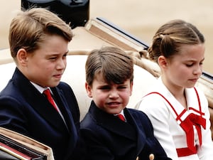 Prince George, Prince Louis and Princess Charlotte riding in a carriage