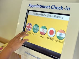 GP surgery check-in screen