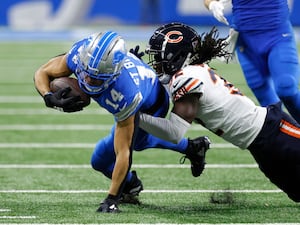 Detroit Lions wide receiver Amon-Ra St Brown is tackled by Chicago Bears cornerback Terell Smith