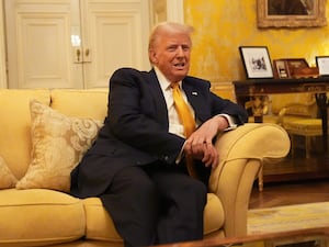 Donald Trump sitting on a sofa