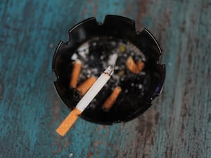 A cigarette in an ashtray