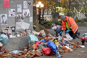 The tributes left near St Peter's Church were moved early on Friday morning