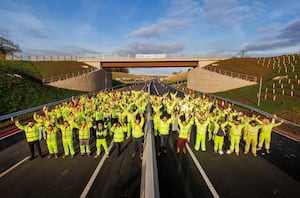 Members of the project team stepped out on the new A road before it opens to the travelling public