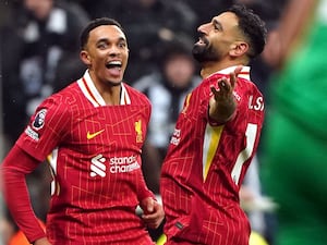 Liverpool’s Mohamed Salah celebrates scoring his side’s third goal at Newcastle