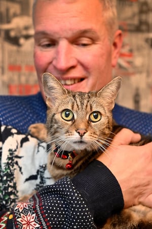 Jon with tabby cat Missy Moo