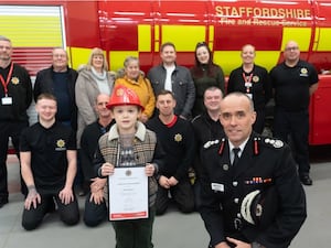 Oliver Nugent with Rob Barber, his family and firefighters at Cannock Community Fire Station 