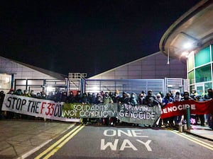 Protesters holding banners