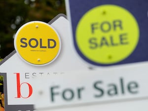 For Sale and Sold signs on estate agent boards