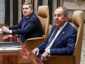 Russian foreign minister Sergei Lavrov, right, sitting next to Russian President Vladimir Putin’s foreign policy adviser Yuri Ushakov