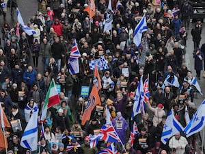 People during a Campaign Against Antisemitism march in central London