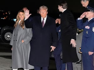 President-elect Donald Trump and Melania Trump walk off an Air Force Special Mission airplane