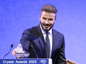 David Beckham speaks as he receives a Crystal Award during the ceremony for the Crystal Awards at the 55th annual meeting of the World Economic Forum, WEF, in Davos, Switzerland (Michael Buholzer/Keystone via AP)