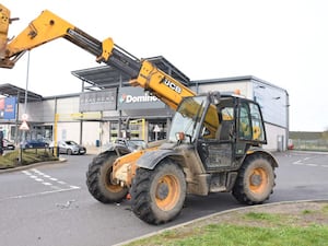 A JCB left at the scene of a ram raid in Harwich, Essex