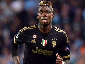 Midfielder Paul Pogba, wearing a black Juventus kit, in action